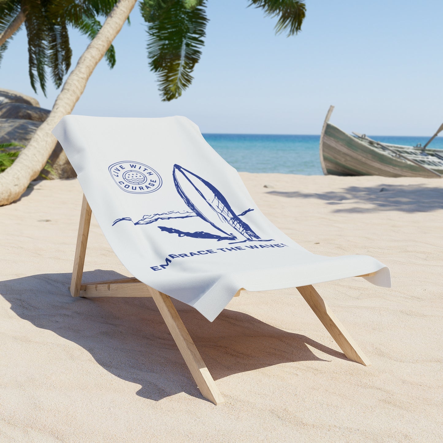 A beach towel with a surfboard and ocean design, laid out on a beach chair with a tropical setting in the background and the wording "Embrace the Waves" with the Live With Courage®️ logo.