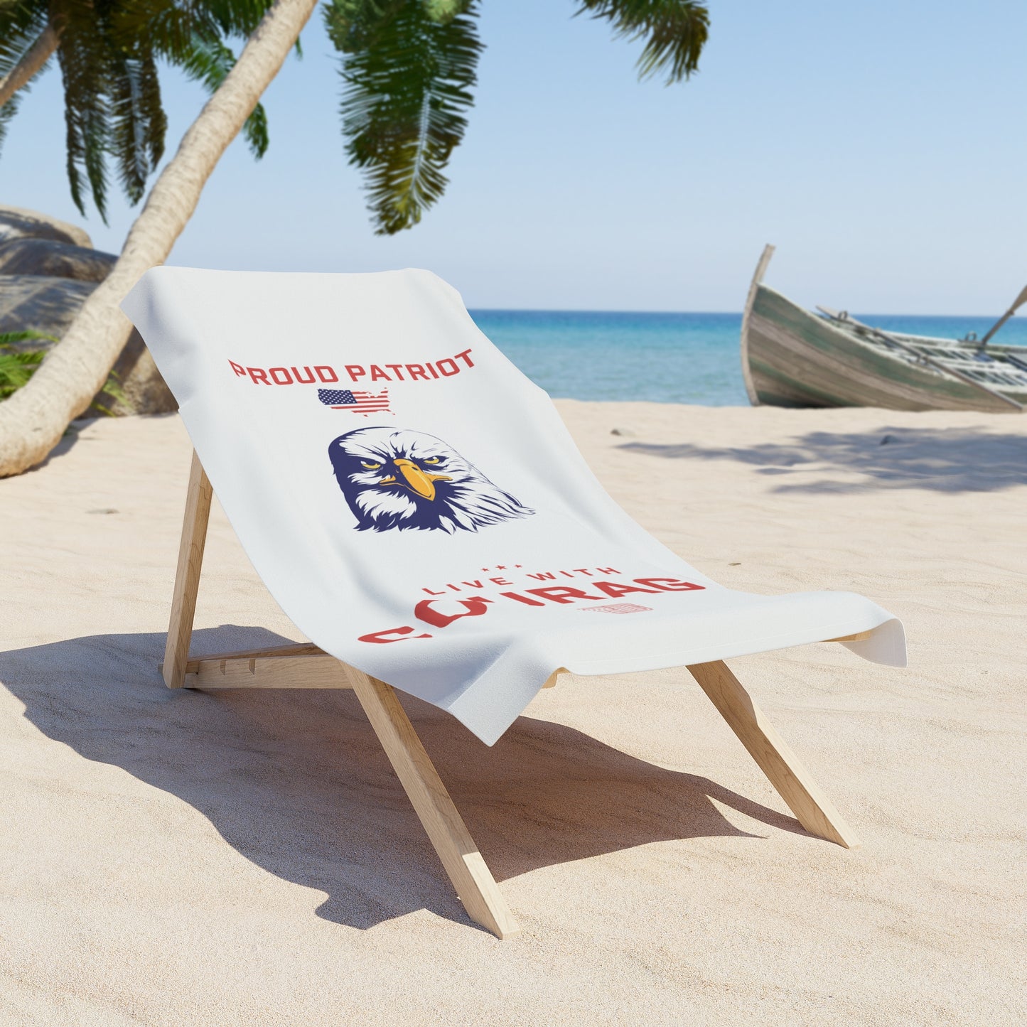 A beach towel laid out on a beach chair with the American Eagle design and the text 'Proud Patriot'.