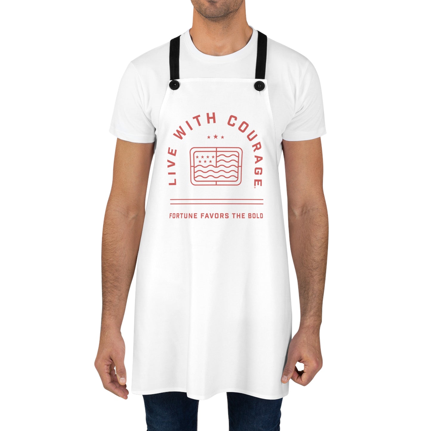 A person wearing a white apron with the text 'LIVE WITH COURAGE' printed on the front.