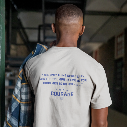 Man wearing a t shirt with the quote "the only thing necessary for the triumph of evil s for good men to do nothing"