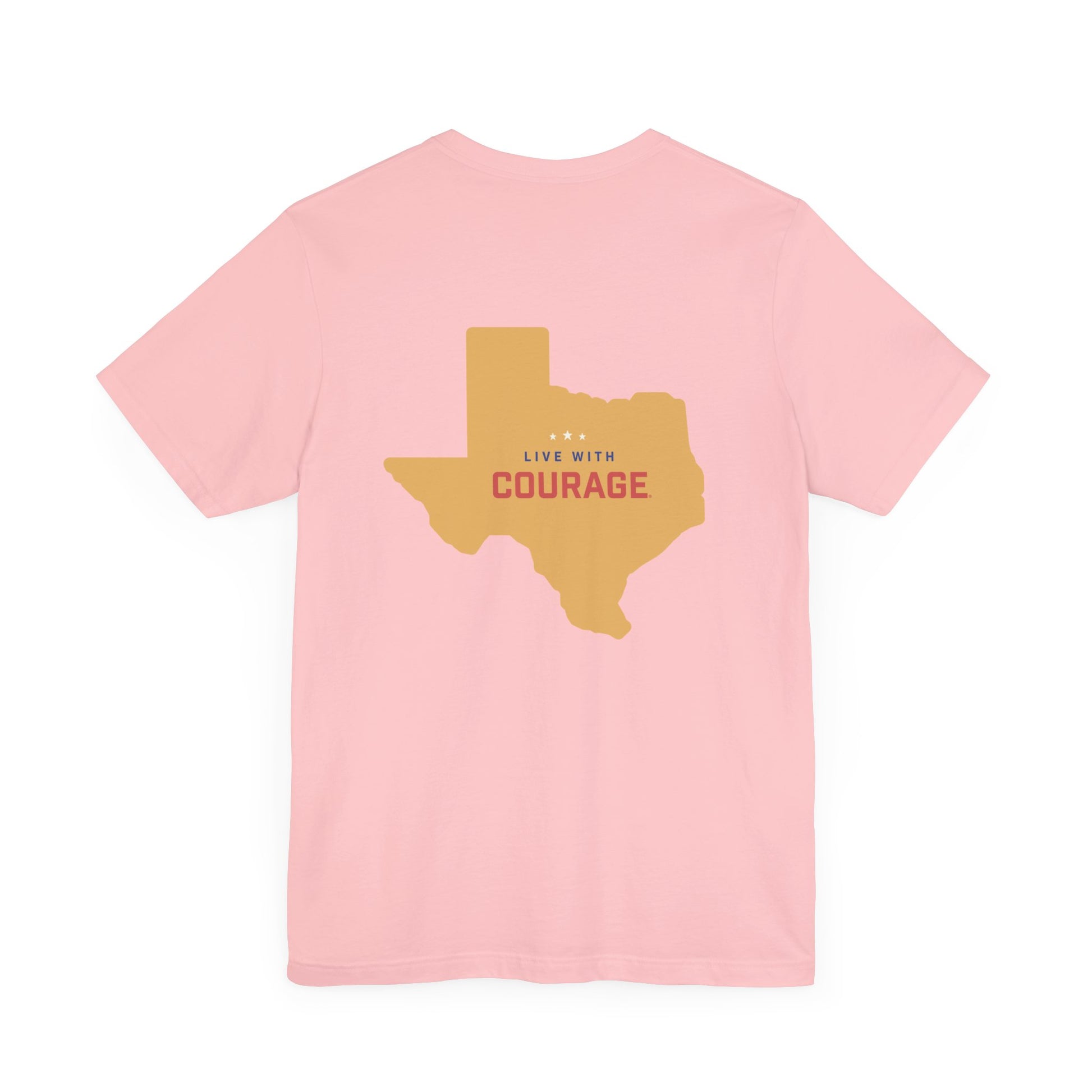 a pink t shirt with the outline of the state of Texas in gold and the words Live With Courage®️ in red white and blue in the center.