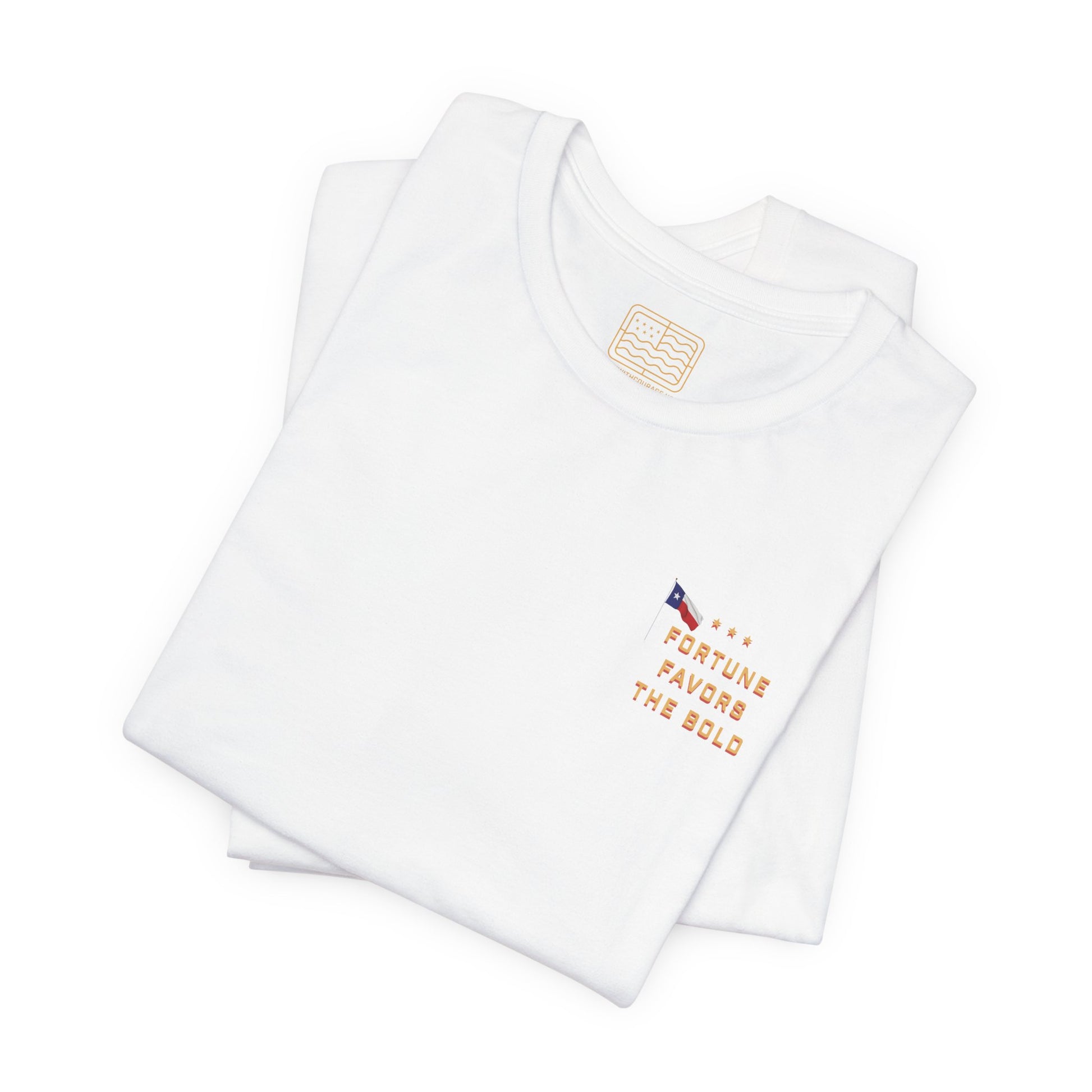 A folded  white T shirt with Fortune Favors the Bold on the chest with the Texas flag.