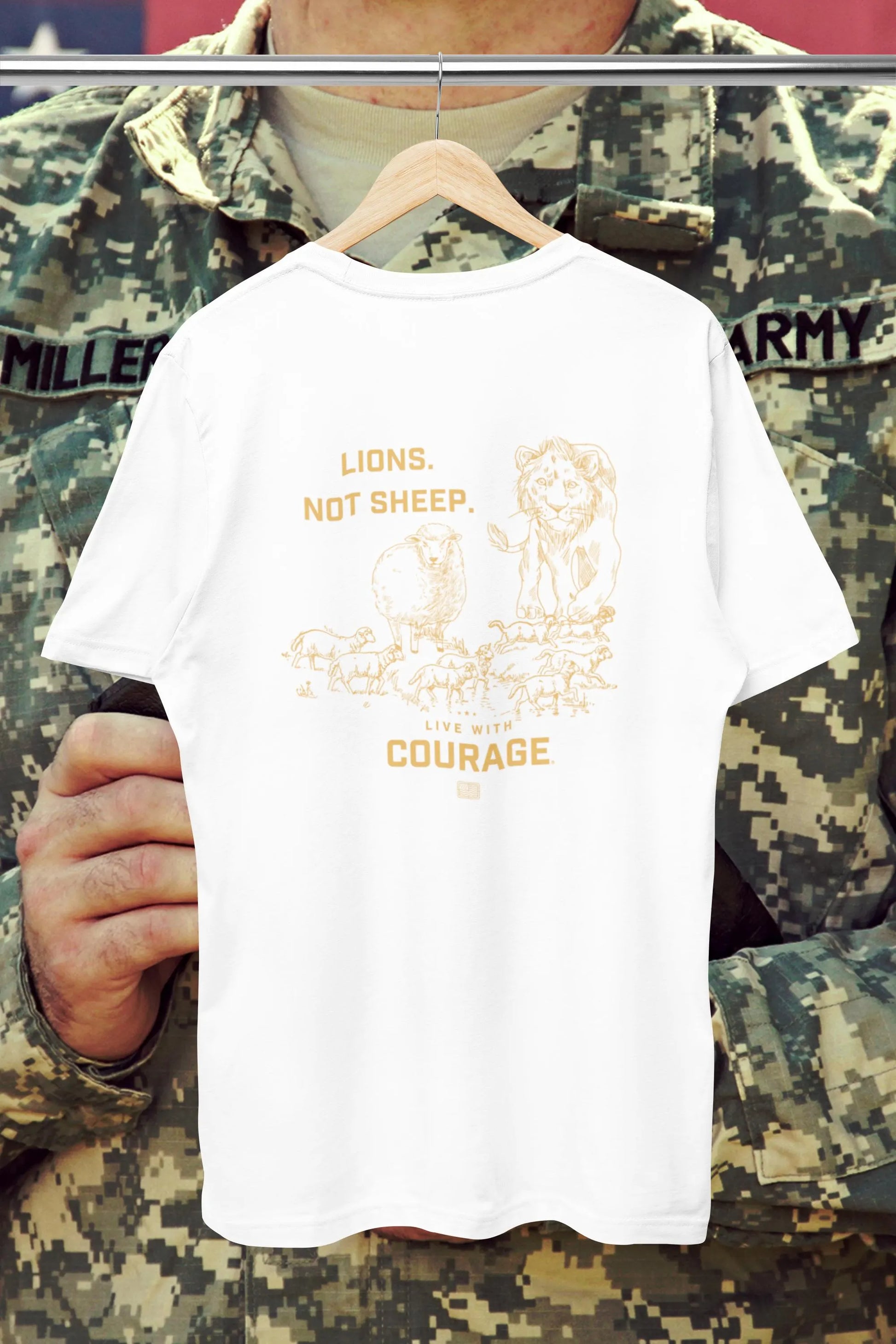 A white unisex short sleeve tee with a graphic of a lion and sheep and the text 'LIONS NOT SHEEP' and 'LIVE WITH COURAGE'.