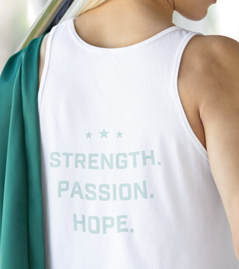 Person wearing a white tank top with 'STRENGTH. PASSION. HOPE.' text.